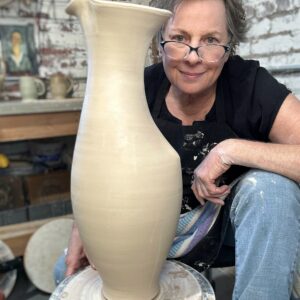 Sarah Wells Rolland, Ceramic Artist and Pottery Instructor with a darted pitcher at The Village Potters Clay Center