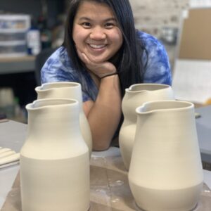 Katie Meili Messersmith, ceramic artist and instructor, with leather hard clay pitchers